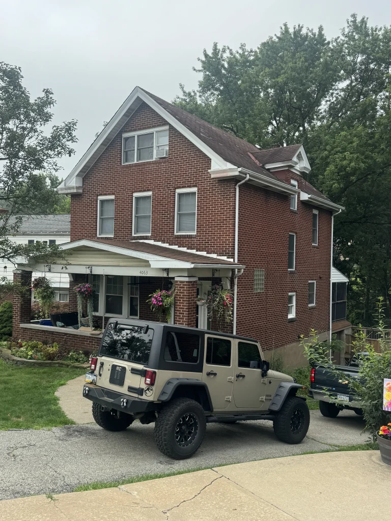 Completed roof installation using Atlas Pristine shingles on residential home in Pittsburgh PA