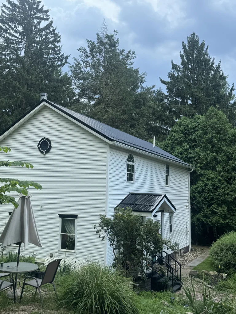 Completed residential metal roof installation with clean shingle finish in Pittsburgh PA