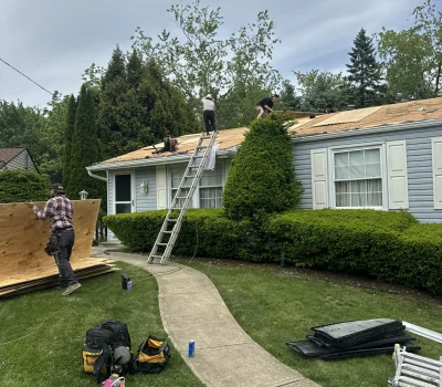 Active roof replacement project with professional crew installing new roofing system for longterm protection. Roof replacement in progress with crew installing asphalt shingles in Pittsburgh PA