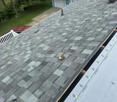 Initial roof tear-off stage removing old materials to prepare for a full roof replacement. Roof tear off process preparing residential home for new roofing installation in Pittsburgh PA