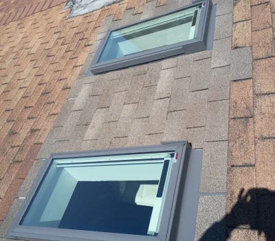 New skylight installed with proper flashing integration to ensure leak protection and natural light. Skylight installation on asphalt shingle roof with flashing detail in Pittsburgh PA