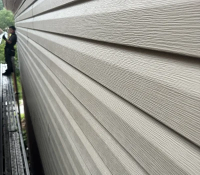 New siding installation providing improved insulation, durability, and a refined exterior finish. Vinyl siding installation on residential exterior wall with clean finish in Pittsburgh PA