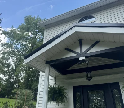 Standing seam metal roof providing longlasting protection, energy efficiency, and clean architectural lines. Standing seam metal roof installation on residential home in Pittsburgh PA