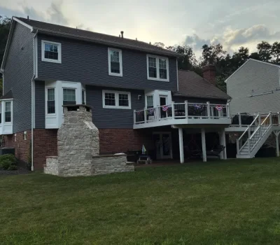 Spacious elevated deck designed for outdoor living and enhanced backyard usability. Elevated backyard deck installation on residential home in Pittsburgh PA